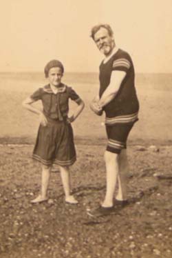 W. H. G. T. playing with his daughter at the beach. Click for enlarged image.